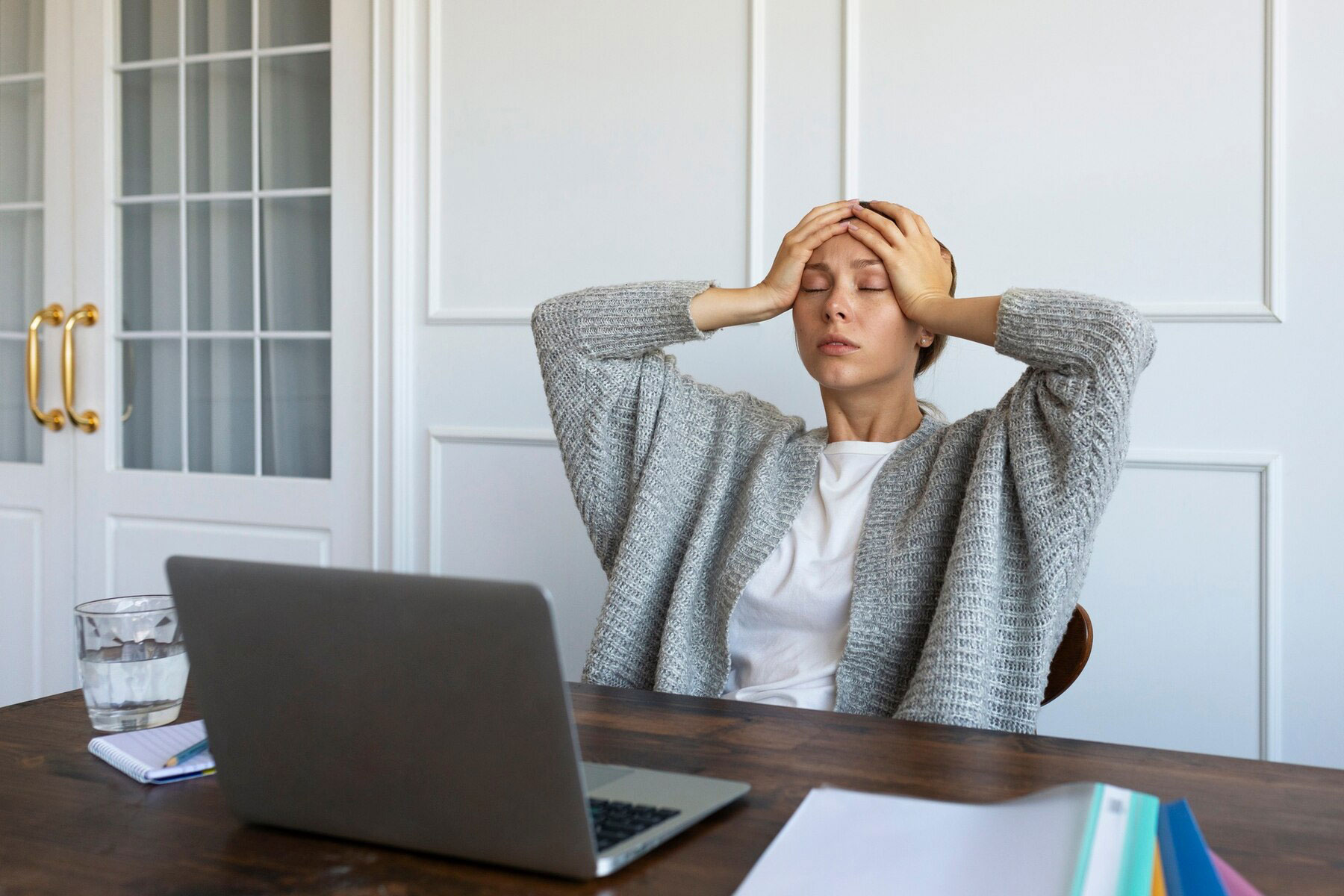 sfw-medium-shot-worried-woman-desk_23-2149729019